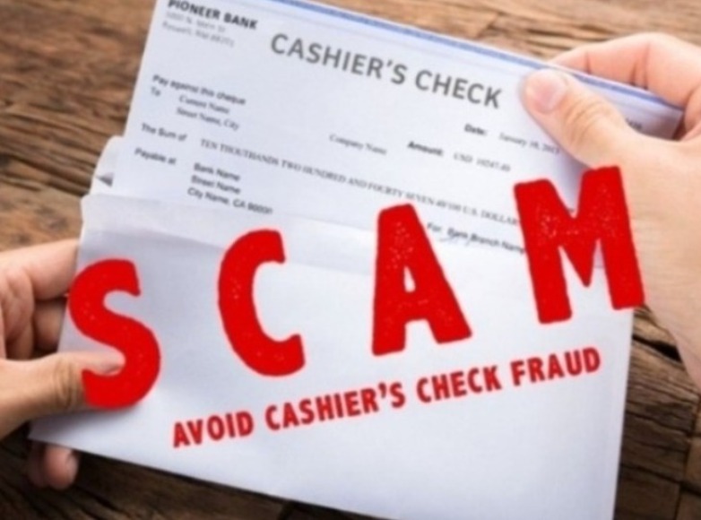 A picture of a fraudulent cashier's check. A caption above the check says: scam, avoid cashier's check fraud. 